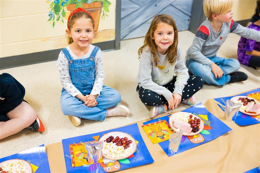 Students eat a Thanksgiving snack